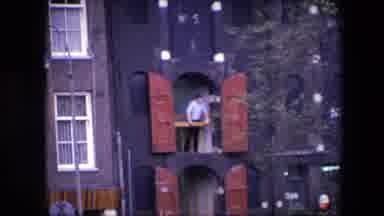 Amsterdam Netherlands (1967): Man Standing And Looking Out A Large, Second-Story