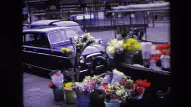 Amsterdam Netherlands (1967): A Street With A Mobile Flower Shop, Parked Cars, And