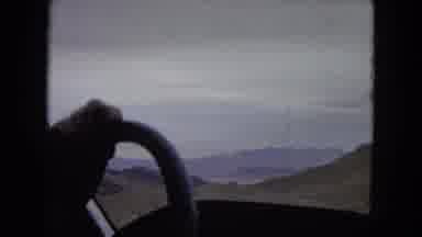 Arizona (1967): Man Driving On The Road Through The Mountains Towards The Horizon
