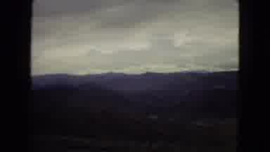 Arizona (1967): Partly Cloudy Roadside Hills And Mountains Overlooking A River