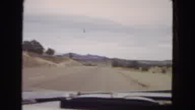 Arizona (1967): Driving Down A Road In A Car