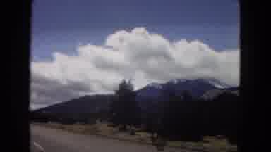 Arizona (1967): Driving On The Road Looking At The Blue Sky And White Clouds