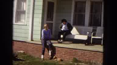 Arizona (1967): People Sitting Porch Furniture Green House Cat On Grass
