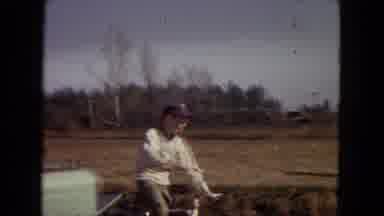 Arizona (1967): Boy Riding By Girls On His Bicycle