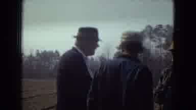 Arizona (1967): Older Gentleman Speaking With Two Others