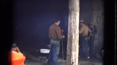 ARIZONA-1967: Group Of Blue Collar Men Mix Work With Relaxation At Industrial Site