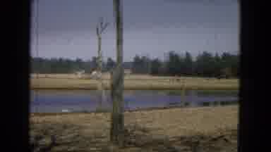 Arizona (1967): Men Walking Next To Body Of Water
