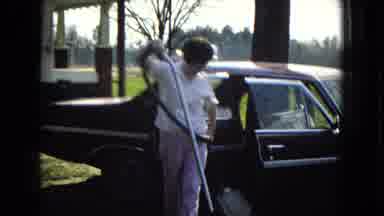 ARIZONA-1967: Lady Using Vacuum To Clean Car