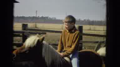 Arizona (1967): A Boy Rides A Pony As A Man And Other Children Watch