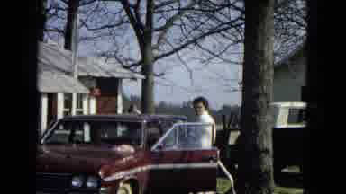 Arizona (1967): Woman Getting Out Of Car Between Two Houses