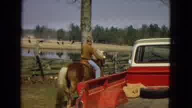 Arizona (1967): Man Being Trained How To Ride A Pony On Farm.
