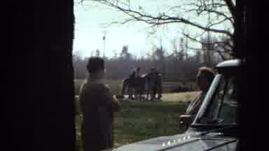 Arizona (1967): Group Of People By Horse As Two Others Talk Near Car