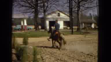 Arizona (1967): Man Riding Horse In Yard