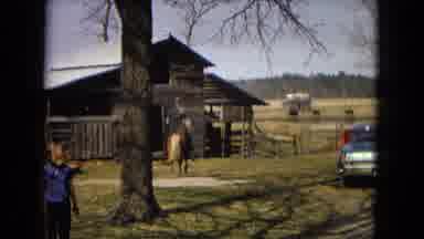 Arizona (1967): Man On A Horse In Front Of A Wooden House
