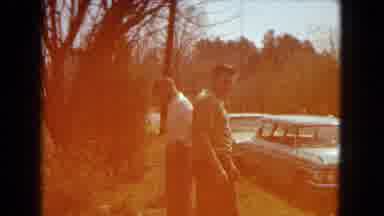 Arizona (1967): Two Men Stand On The Side Of A Road As A Woman And Girl Approach