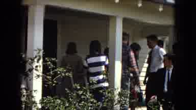 Arizona (1967): Person Leaving Building Through A Large Crowd Gathered In Front.