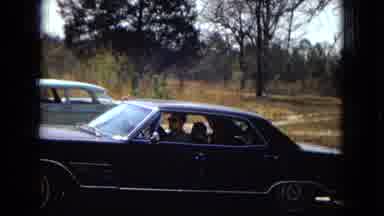Arizona (1967): A Car Drives Up To A House With People On The Porch