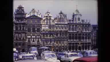 Brussels Belgium (1967): Ornate Buildings In From Of Car Park On Street