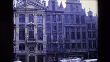 BRUSSELS BELGIUM-1967: Zooming In On Ornate Building With Classic Cars