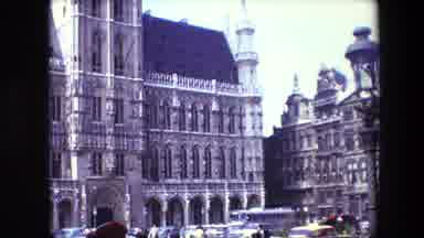 Brussels Belgium-1967: Busy Street Full Of Buses And People In Front Of Gothic