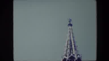 Brussels Belgium (1967): A Figure Atop A Steepled Building.