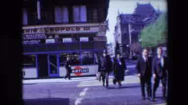 Calais France (1967): People In Coats Crossing City Street In Crosswalk.