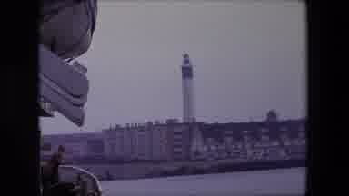 Calais France (1967): A Person On A Ship Looks At A Lighthouse And Town On The