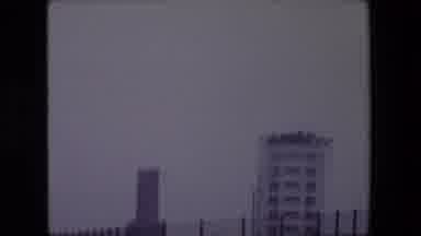 Calais France (1967): A Tall White Building And A Sea Shore