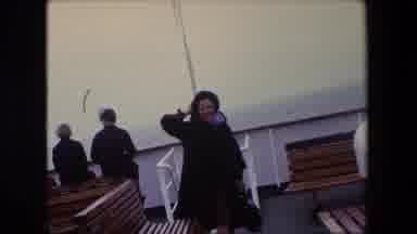 Calais France (1967): A Woman Standing On A Boat Deck, Near Benches.