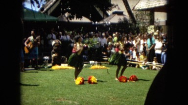 1967:HONOLULU HAWAII. Some Women Hula Dancing While A Band Plays Behind Them.