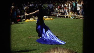 1967: Honolulu Hawaii. Women Hula Dancing While a Band Plays Behind Them.