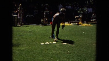 1967:HONOLULU HAWAII. Some Women Hula Dancing While A Band Plays Behind Them.