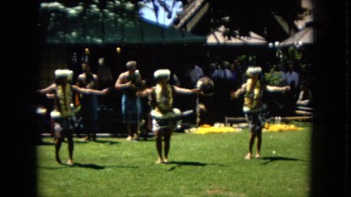 1967:HONOLULU HAWAII. Some Women Hula Dancing While A Band Plays Behind Them.
