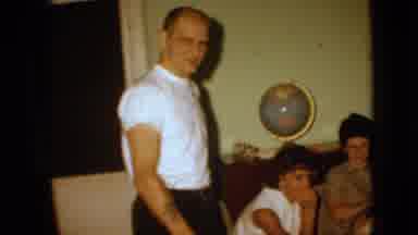 Iowa USA (1967): Four Family Members In Living Room, Older Man With Tattoo On