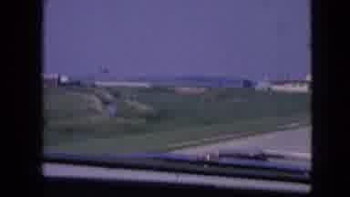 Iowa USA (1967): Car Driving Fast On Highway To Beat Storm