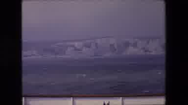 London England (1967): A Boat Sailing The Ocean And Encounters An Iceberg