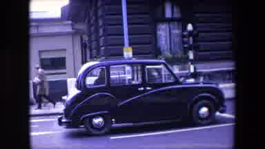 London England (1967): European Taxi Cab Stopped At A Traffic Light On A City