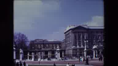 London England (1967): People Passing A Large Stone Building