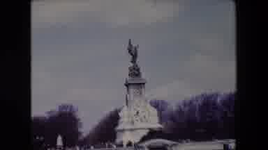 London England (1967): Angel Statue Pointing Cloudy Sky Lisbon Square Around Trees