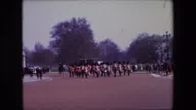 London England (1967): British Guards Marching On A Grassy Field