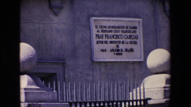 Madrid Spain (1967): Automobile Traffic Passes In Front Of An Old Building With A