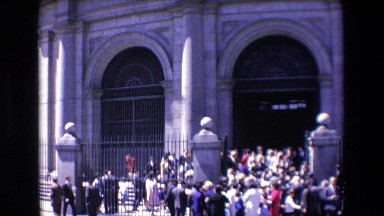 Madrid Spain (1967): City Scene With Vehicles Driving By And Crowd Onlooking