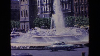 Madrid Spain (1967): City Street With Large Fountain While Traffic Rushes By