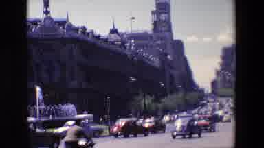 Madrid Spain (1967): A Busy Street Flanked By A Water Fountain Cuts Through Tall