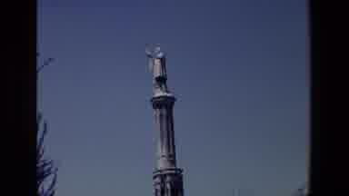 Madrid Spain (1967): Statue Of A Man In Robes Holding A Flag On A Tall Pedestal