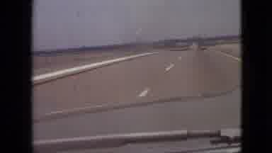 Branson Missouri USA (1968): Car Driving Down Flat Road Way City In Background In