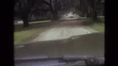 Branson Missouri USA (1968): A Car Driving Down A Dirt Road