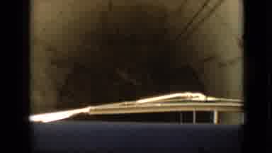 Branson Missouri USA (1968): Car Driving Out Of Tunnel, With A Gated Fence Saying