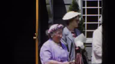 California USA (1969): Ladies Waiting In Front Of A House