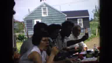 California USA (1969): Family Eating And Drinking At Get Together